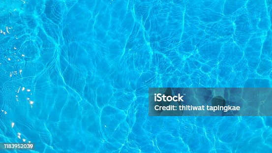 istock blue ripple water in swimming pool. surface of water in blue texture background. top view and copy space for summer vacation. 1183952039