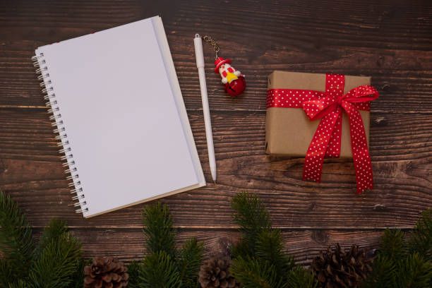 istock Christmas Present And Book On Table 1183955041