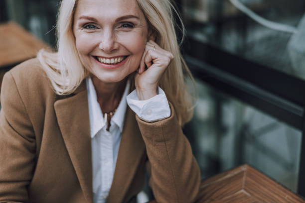istock Happy pretty woman is looking ar camera 1183955780
