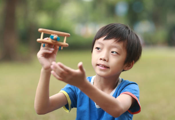 Boy hand holding a toy plane