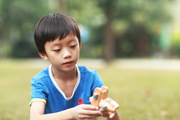 istock Boy Holding  Toy Airplane 1183956226