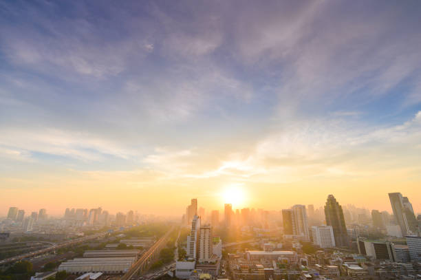 Aerial view dramatic sunset and sunrise sky nature background with white clouds Aerial view dramatic sunset and sunrise sky nature background with white clouds for design concept and isolated text material bangkok city sunrise stock pictures, royalty-free photos & images