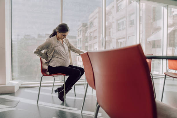istock Pregnat woman working at the office 1183956734