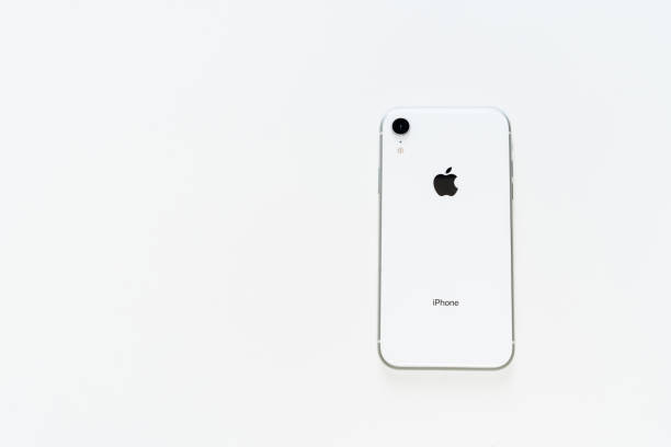Smart Mobile Phone White Back Isolated Flat Lay KYIV, UKRAINE - FEBRUARY 27 2019: iPhone xr White Back Isolated Flat Lay. Smart Mobile Phone Behind Side Mockup Minimal Background. Modern Blank Telephone Device Silhouette. Apple Empty Digital Gadget extinction rebellion stock pictures, royalty-free photos & images