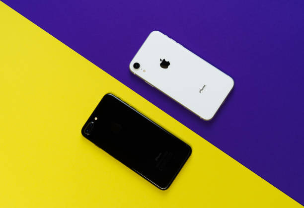 Smartphone Yellow Purple Background Top Flat Lay KYIV, UKRAINE - FEBRUARY 27 2019: iPhone Xr and iPhone 8 Smartphone Yellow Purple Background Top Flat Lay. Black and White Mobile Phone Mockup Above View Copy Space for Bright Minimal Illustration extinction rebellion photos stock pictures, royalty-free photos & images