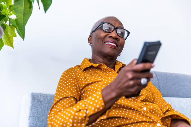 istock Senior Woman Watching Tv 1183957966