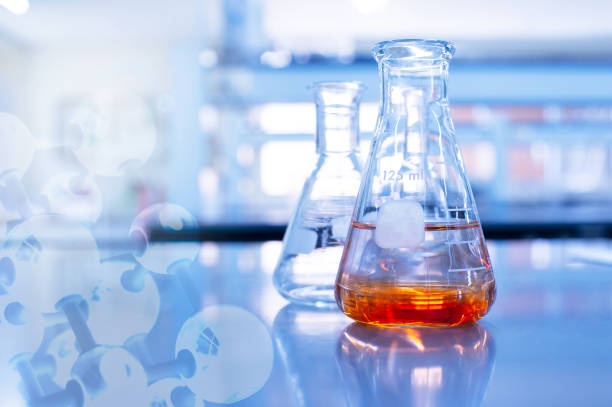 istock orange solution in glass flask and chemical molecular in chemistry science educational blue background 1183958264