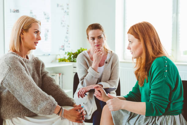 istock Females discussing in group therapy session 1183960316