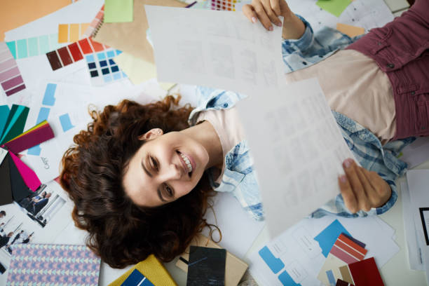 istock Creative Young Woman Holding Photographs 1183961205