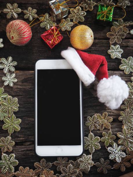 istock Smart phone with christmas hat 1183961493