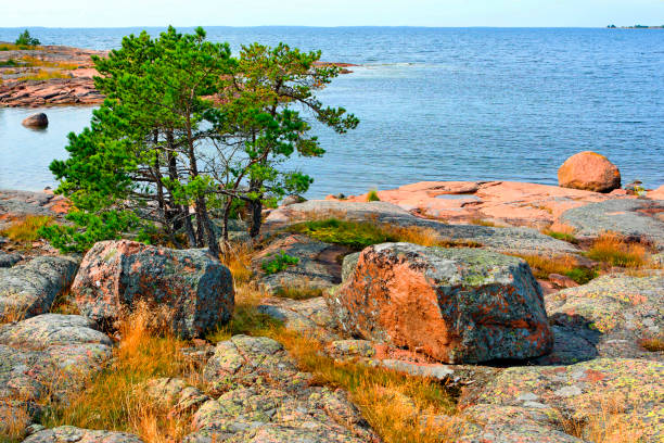 Rocky red granite seashore in Käringsund, Aland Islands (Finland).