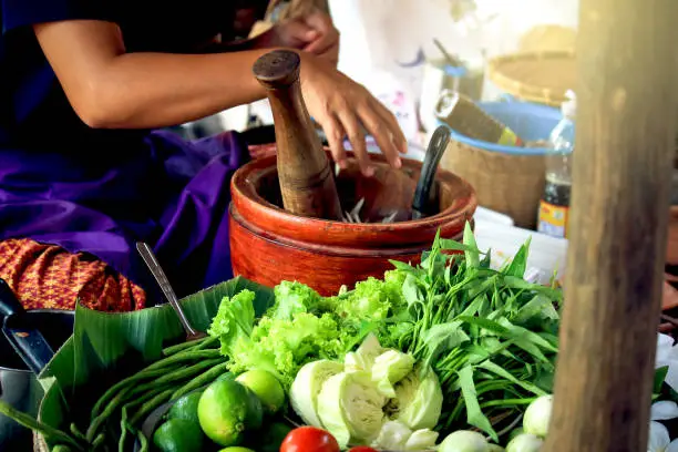 Making of green papaya salad, som tam, famous Thai food, Sukhothai, Thailand. On Sep 29, 2019.