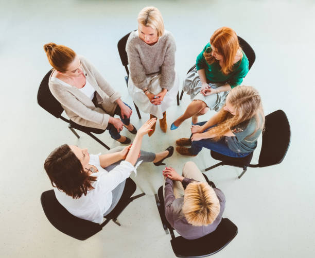 istock Women in group discussion during therapy session 1183961942