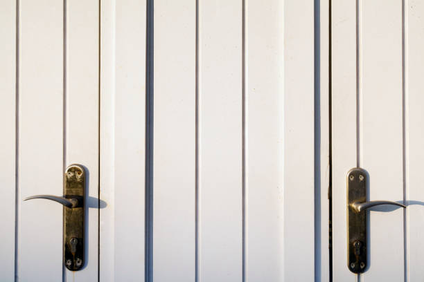 istock Closed wooden front door with two handles. 1183963217