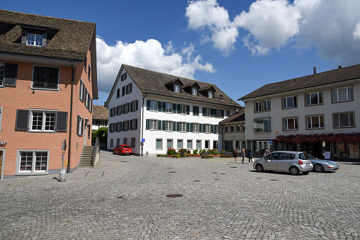 Küsnacht (Zürich) with its village square. Küsnacht has a population of nearby 14'000 and is located next to the lake of zurich. The image was captured during summer season.