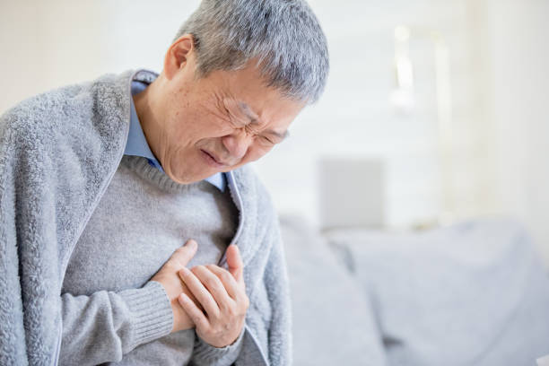 istock asian elderly man feel chest pain 1183963567