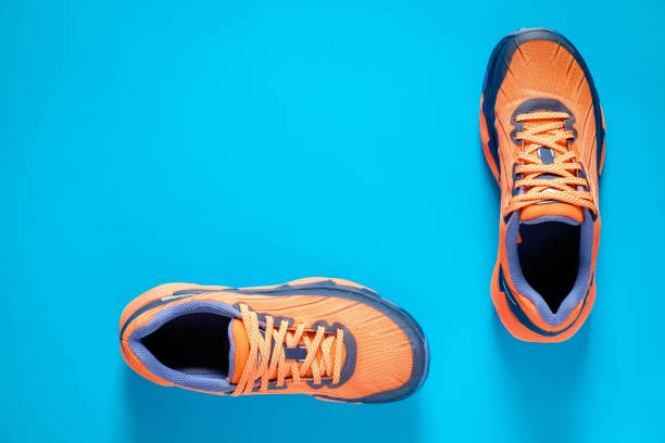 istock Shoes Against Blue Background 1183965266