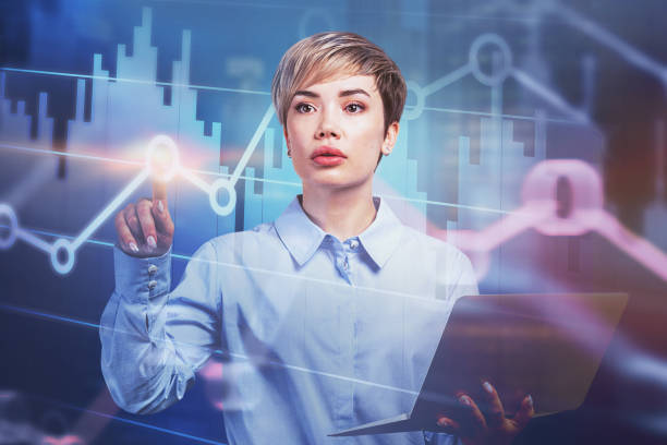 istock Young businesswoman with laptop working with graph 1183968169