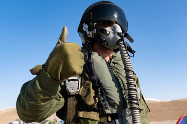 istock Pilot with suit and military air. Fighter pilot portrait posing 1183968369