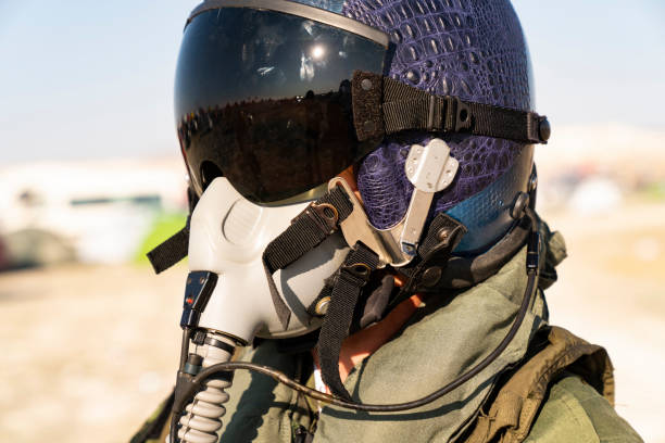 istock Pilot with suit and military air. Fighter pilot portrait posing 1183968372