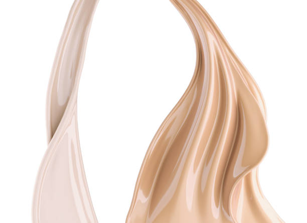 istock flow of liquid foundation splash cream. 1183968759