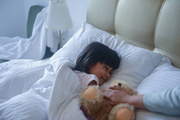 istock Asian girl on the bed 1183968952