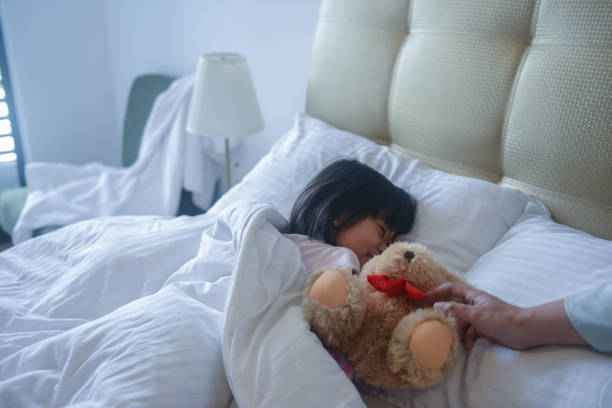 istock Asian girl on the bed 1183969030