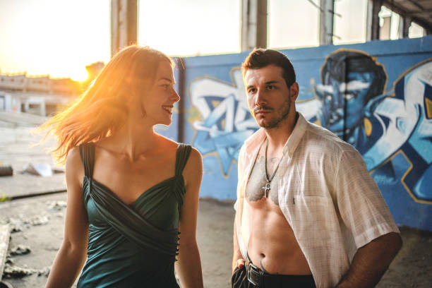 istock Stylish young couple at sunset 1183971463