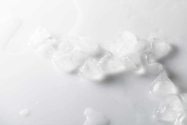 istock Melting ice cubes with water on white background. Overhand. 1183971578