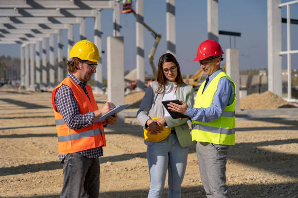 istock Manager, Female Architect and Foreman Meeting on Site Under Construction 1183972516