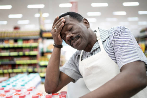 istock Employee or owner feeling bad at working on supermarket 1183973327