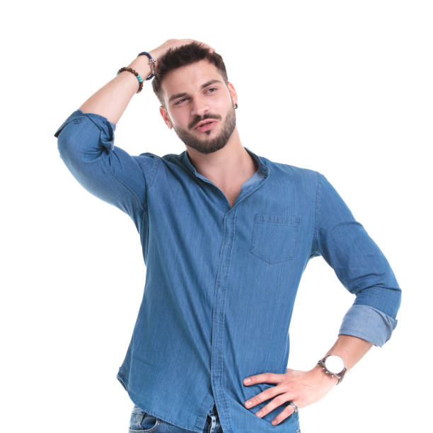 istock Thoughtful man looking away with his hand on his waist 1183975453