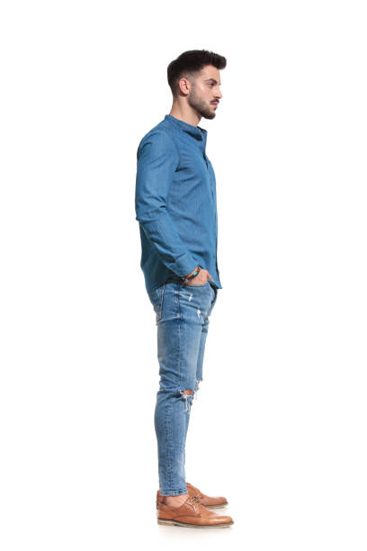 istock Side view of a serious casual man standing 1183975497