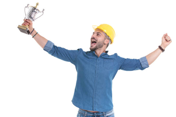 istock Successful casual man celebrating with a trophy and shouting away 1183975975