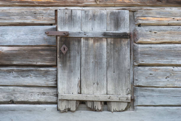 istock Ancient wooden hatch on vintage building 1183976045