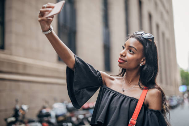 istock Black woman taking a selfie 1183978144