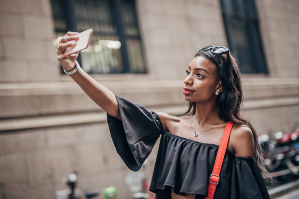 istock Black woman taking a selfie 1183978150