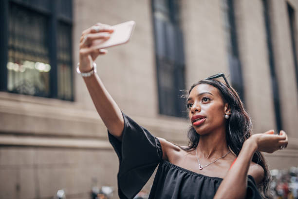 istock Black woman taking a selfie 1183978163