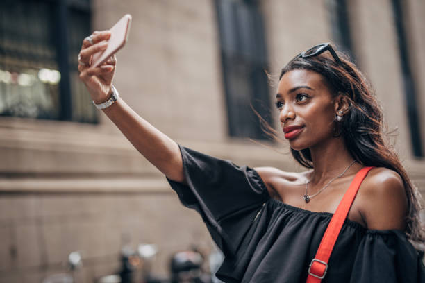 istock Black woman taking a selfie 1183978178
