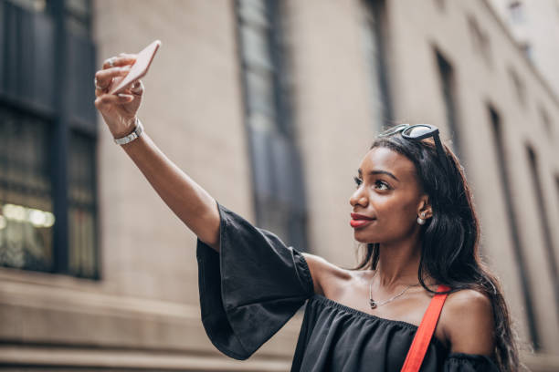 istock Black woman taking a selfie 1183978192