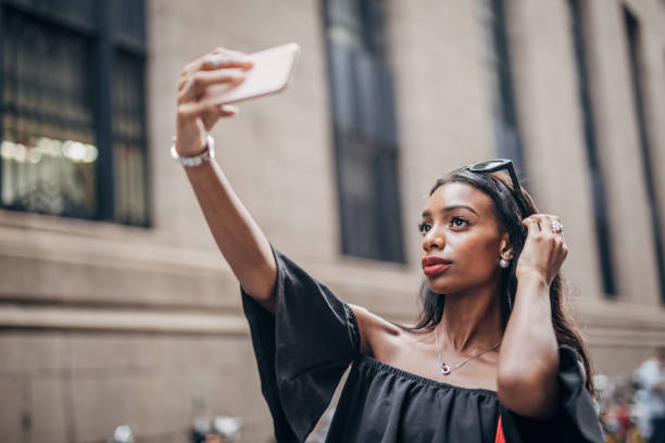 istock Black woman taking a selfie 1183978220