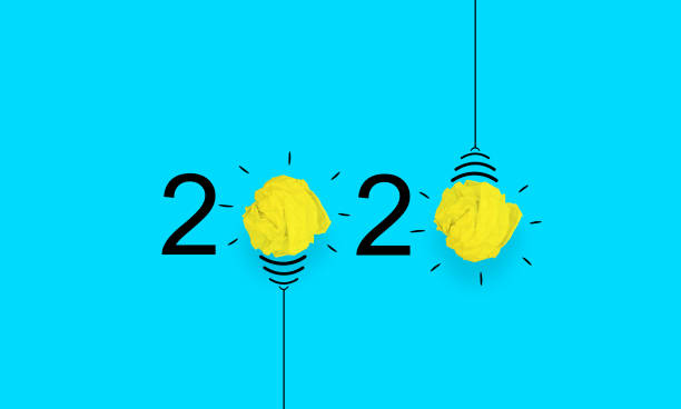istock 2020 idea concept, crumpled paper and lamp 1183978928