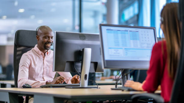 istock African-American man working as a call centre employee 1183979658