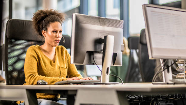 istock Latin American woman working in a call centre 1183979659