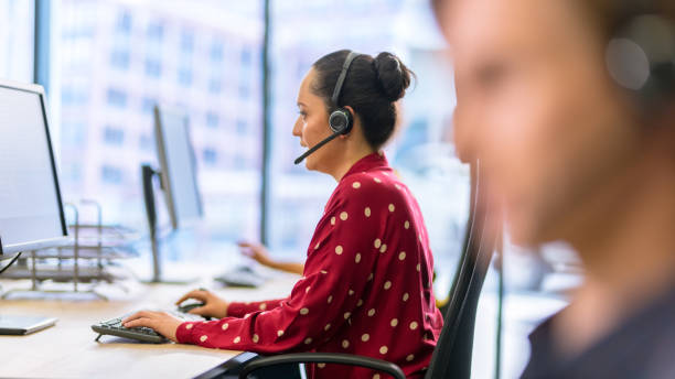 istock Call centre employee talking to customer 1183979661