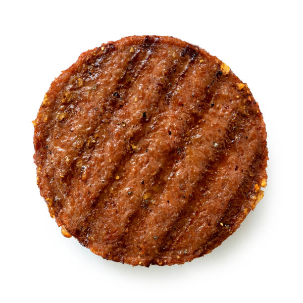 istock Plant based grilled burger patty with grill marks isolated on white. Top view. 1183980306