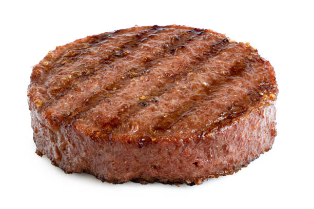istock Plant based grilled burger patty with grill marks isolated on white. 1183980370