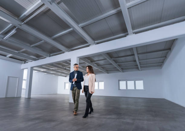 istock Business people discussing in empty office 1183980496