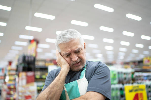 istock Employee or owner feeling bad at working on supermarket 1183984985