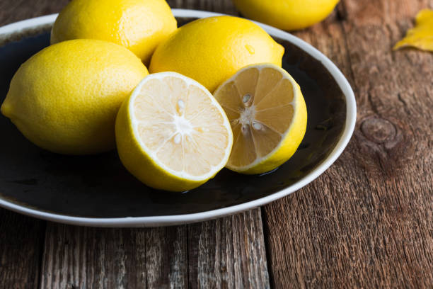 istock Preparing autumn hot drink, lemon fruits 1183987588